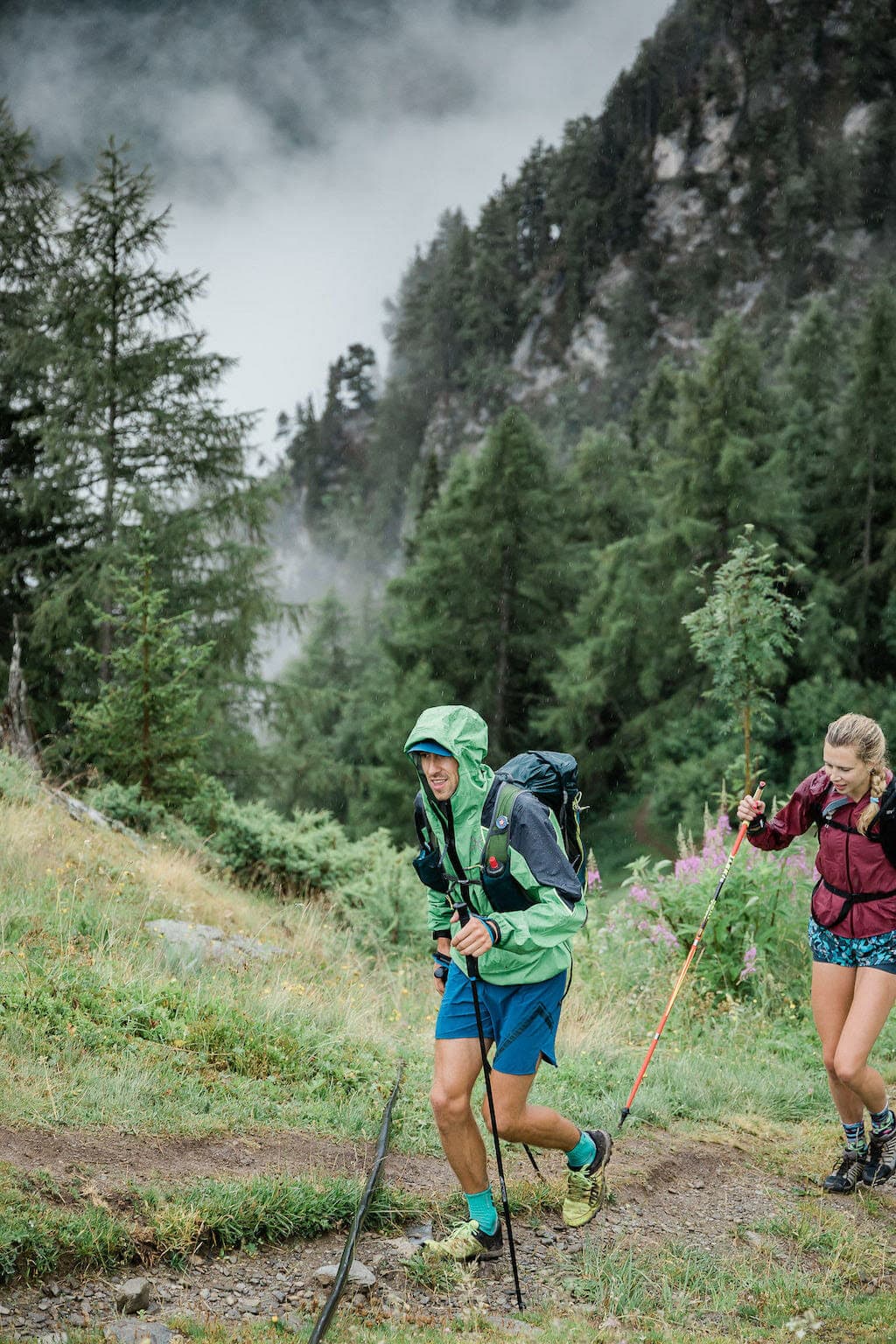 Sam Hill and a female trail runner on a rainy day