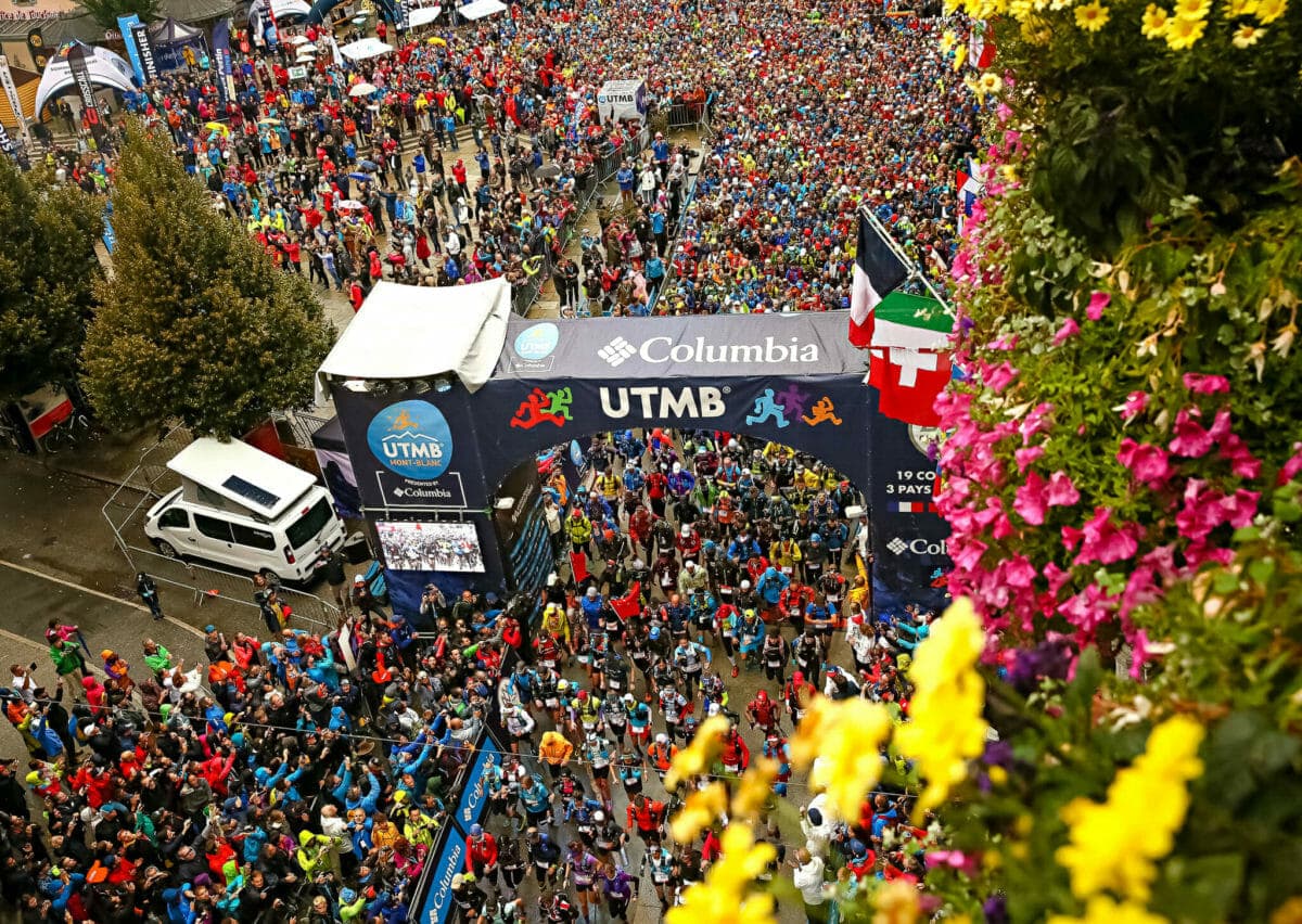 the start of UTMB as seen from above, with thousand of runners leaving Chamonix, France.
