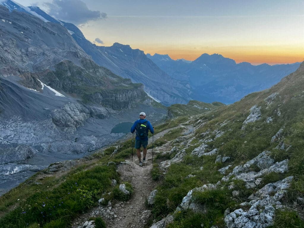 Doug descending from Hohturli pass at sunset