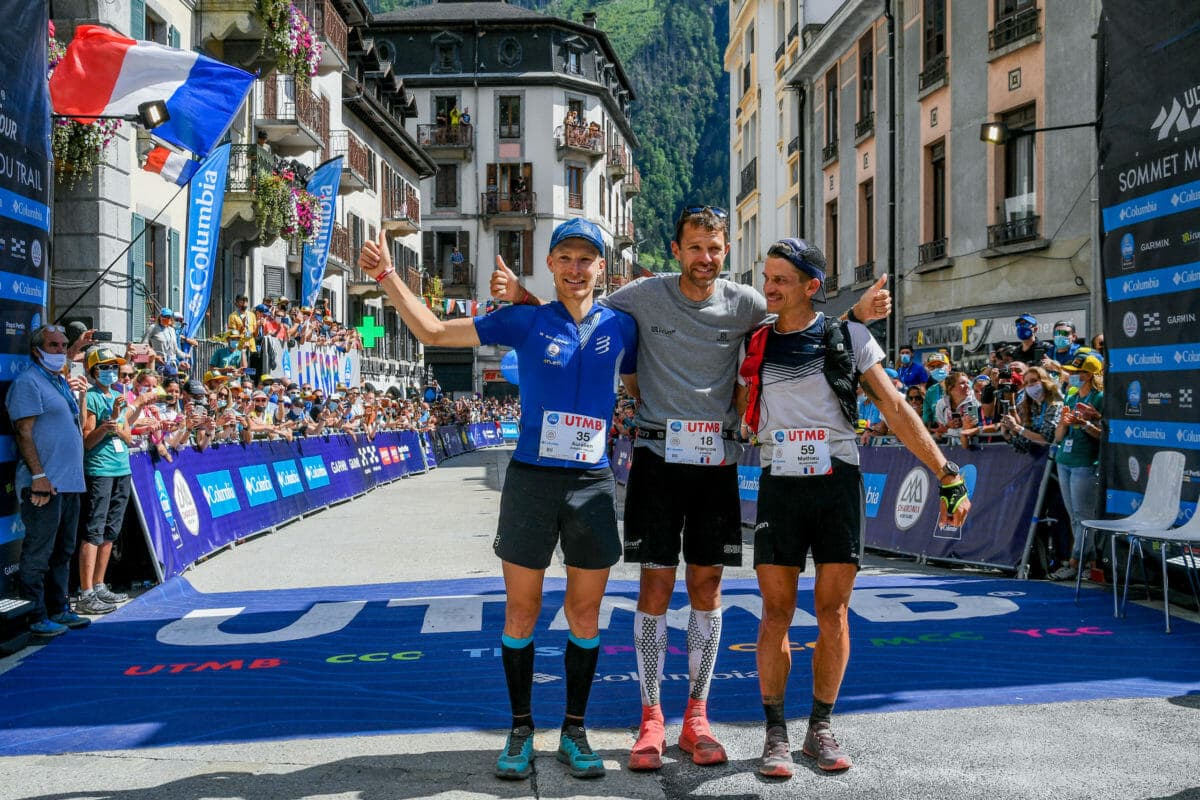 UTMB 2021 The three mens winners celebrate with thumbs up at the finish line