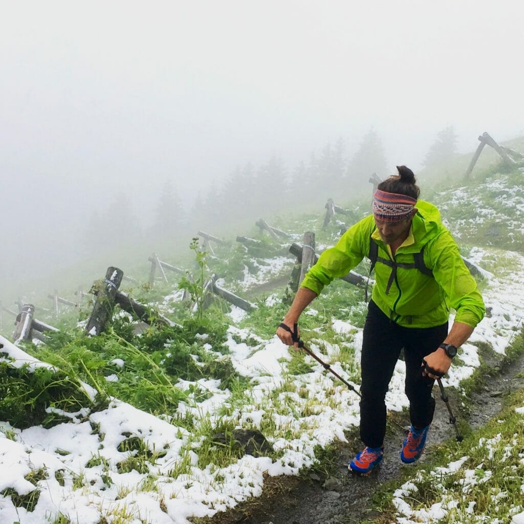 Zach heads into the snow zone, as the trail skirts avalanche anchors and barriers.