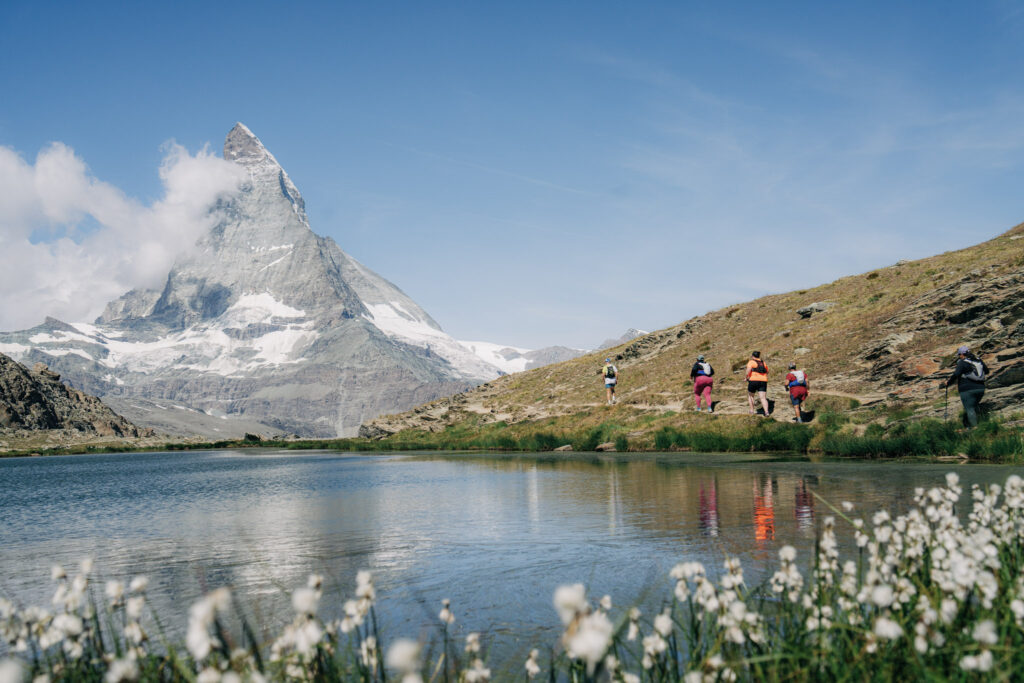 group of 4 runners by the Matterhorn