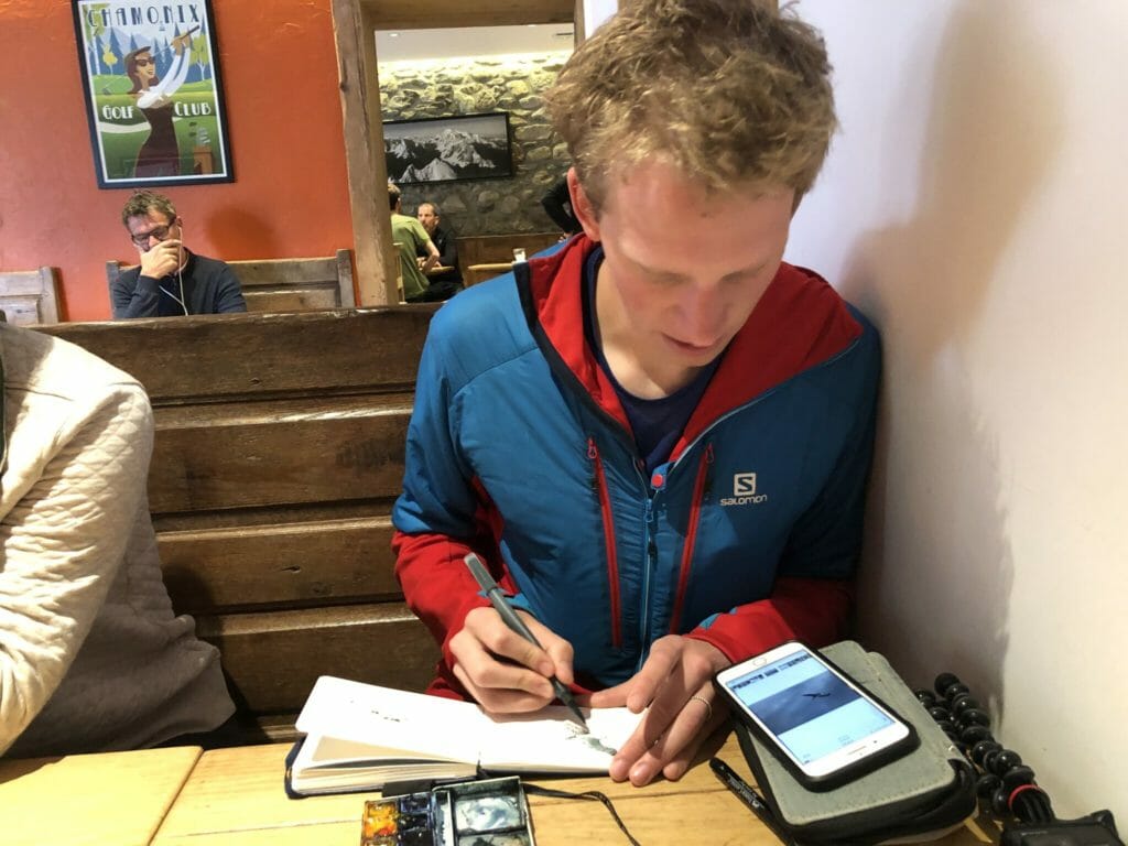 Max Romey painting at L'Atelier. (Photo: Doug Mayer)