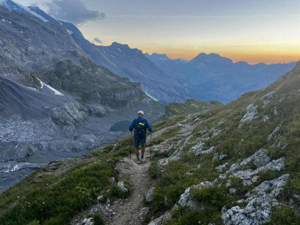 Doug descending from Hohturli pass at sunset