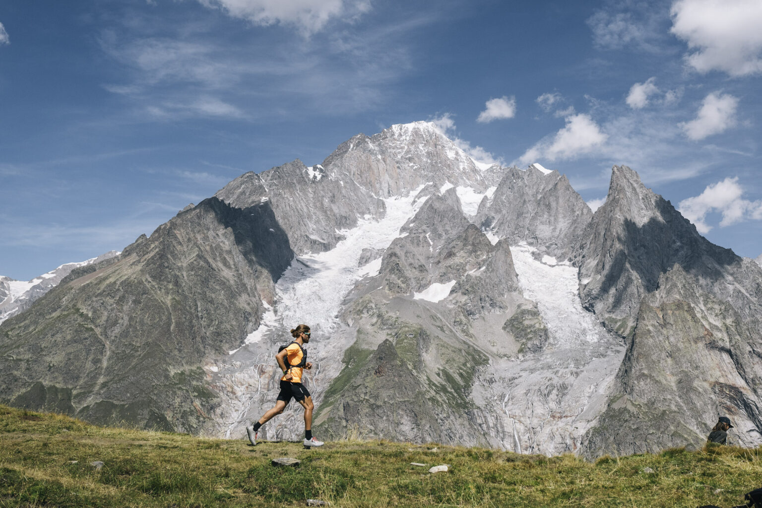 Runner with mountain and glacier in background