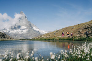 group of 4 runners by the Matterhorn