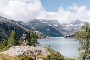 female runner above lake Emosson