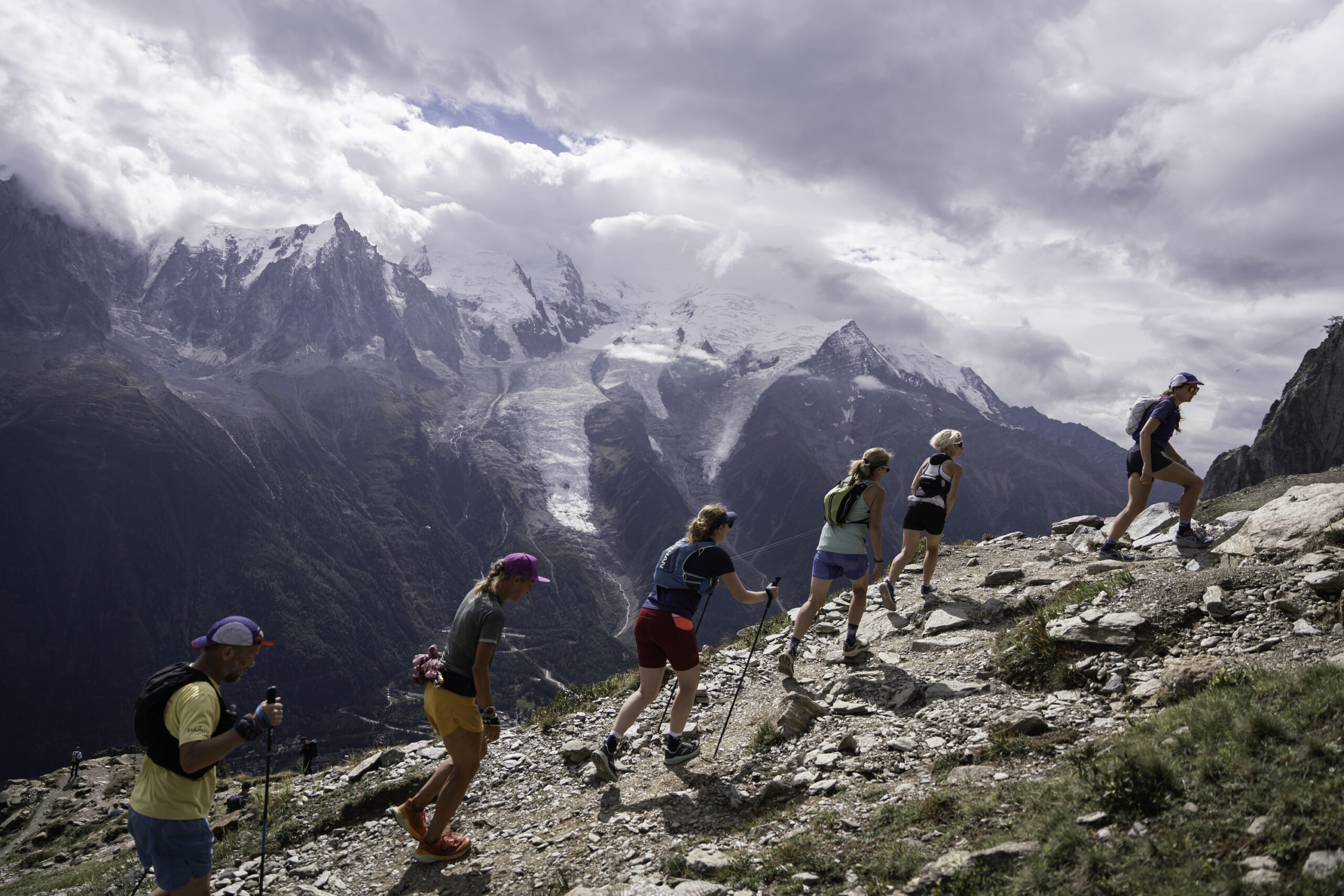 group of runners moving uphill in Chamonix