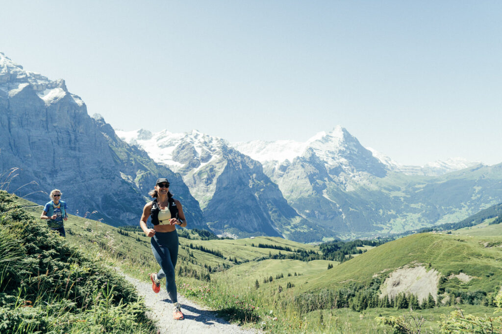 woman running in Swiss Alps