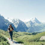 woman running in Swiss Alps