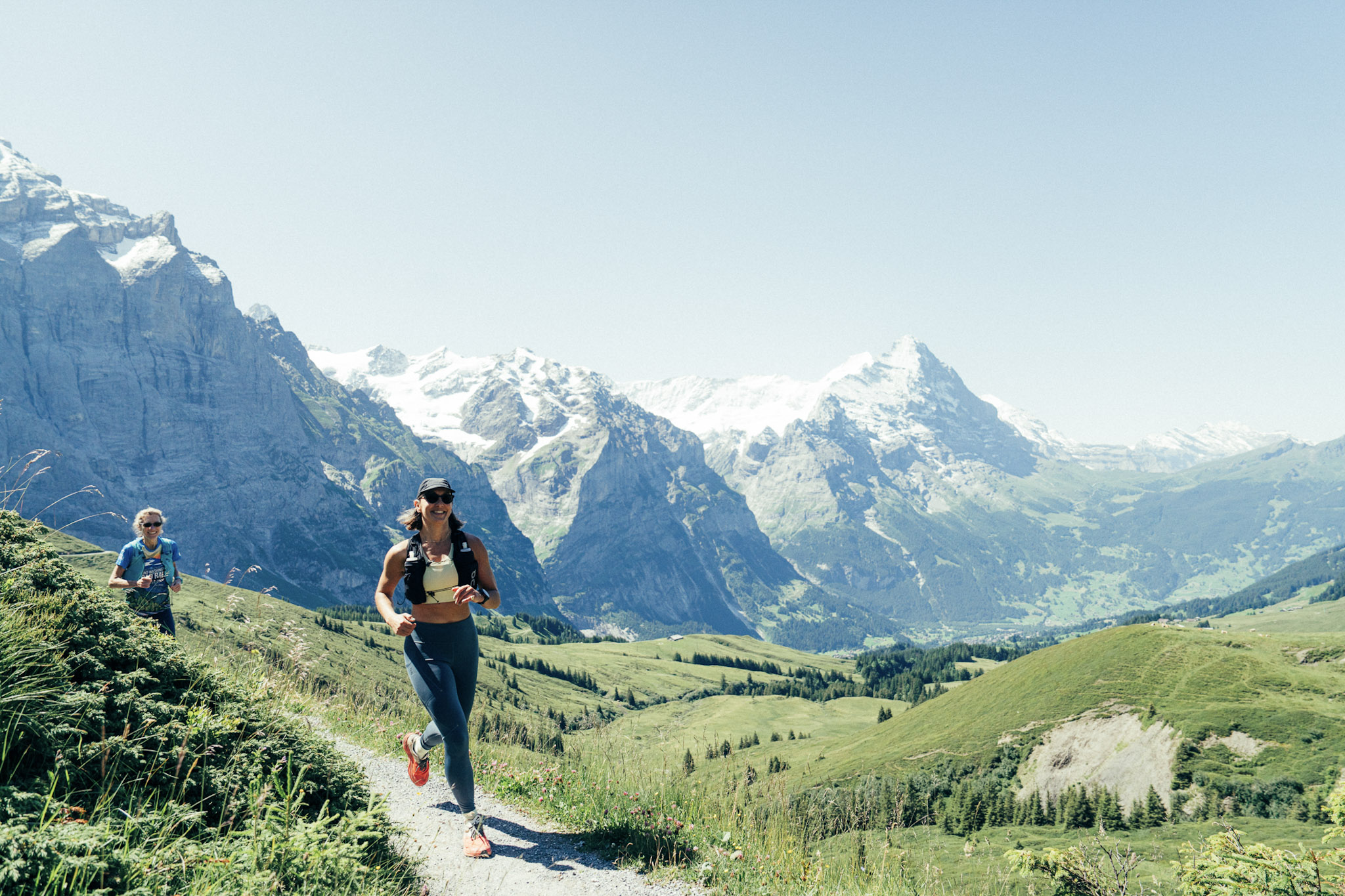 woman running in Swiss Alps