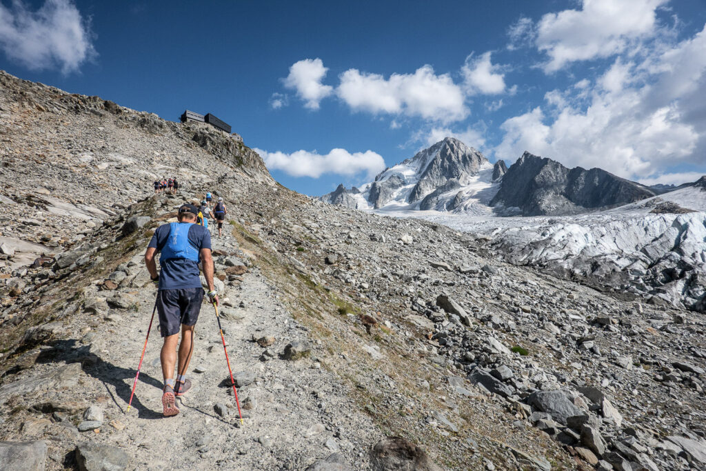 hiker with poles going up to Refuge Albert 1er