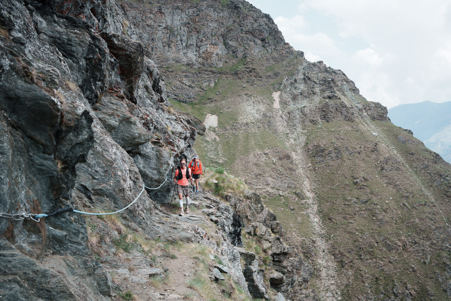 two runners on an airy traverse trail