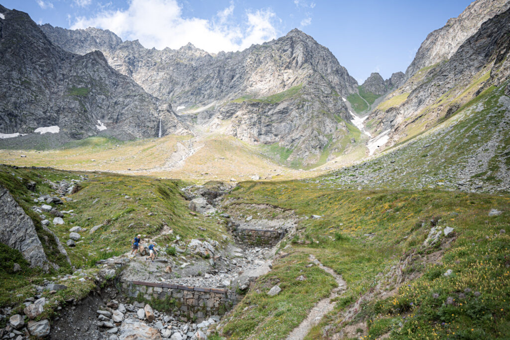 Tor des Geants trail, green hillsides and rocky summits